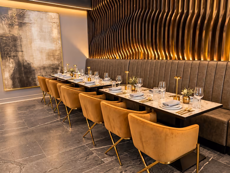 The long communal table at Il Vero set for a large group